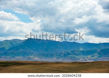 Nature of the Kazakhstan Republic, steppes and hills, mountains and sky Royalty-Free Stock Photo #2028604238