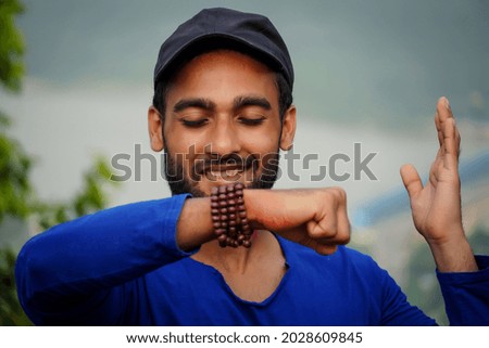 young man showing his hand and making wish