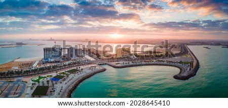 Construction and development at Marjan Island seafront reclaimed land artificial island in emirate of Ras al Khaimah in the United Arab Emirates aerial panoramic view at sunrise Royalty-Free Stock Photo #2028645410