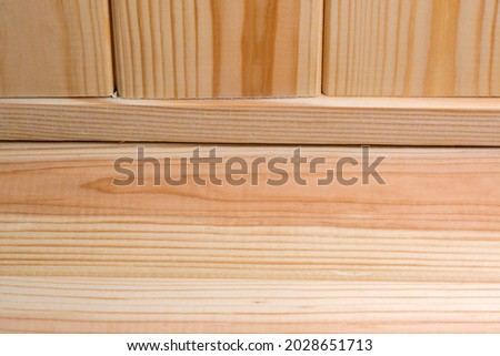 Wooden background from plank surface of light treated wood close-up macro photography