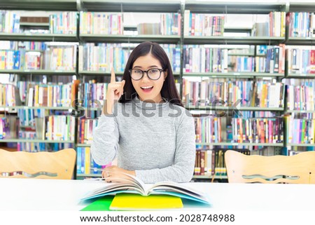 Asian student was reading in the library and Understanding Read books. Education Concept
