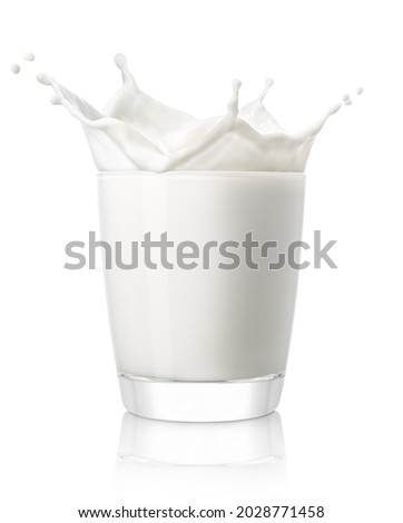 small glass of milk with splash isolated on white background Royalty-Free Stock Photo #2028771458