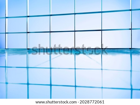 Reflection of boxed glass windows on the floor