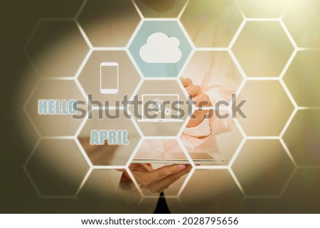 Conceptual display Hello April. Concept meaning a greeting expression used when welcoming the month of April Lady Holding Tablet Pressing On Virtual Button Showing Futuristic Tech.