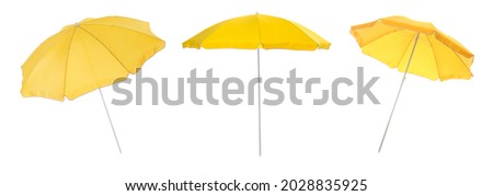 Set with yellow beach umbrellas on white background. Banner design Royalty-Free Stock Photo #2028835925