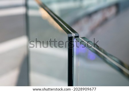 Frameless laminated tempered glass balcony railing. Royalty-Free Stock Photo #2028909677