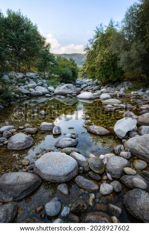 Landscape with rocks and a river that comes down from the mountain in Extremadura (Spain)