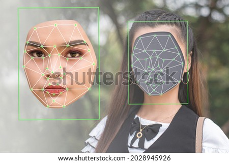 Deepfake concept matching facial movements with a different face of another woman in a photo. Face swapping or impersonation. Royalty-Free Stock Photo #2028945926