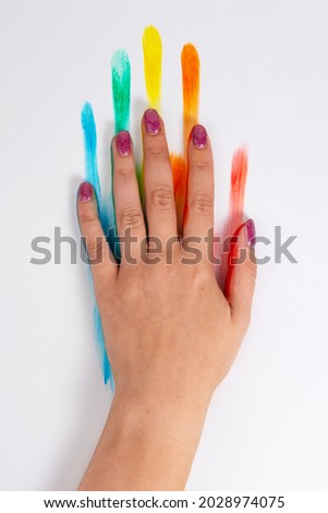 Rainbow lgbt paint color hand isolated on the white background