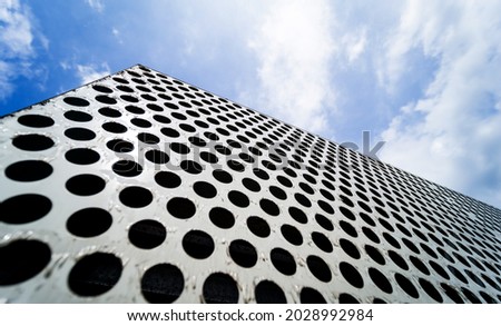 Background sheet of metal with circular holes