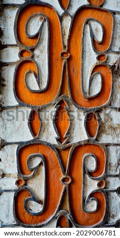Curved patterns and lines from wood carvings of the Asmat Tribe in Papua. This traditional style design pattern is perfect for the needs of both traditional and contemporary art Royalty-Free Stock Photo #2029006781