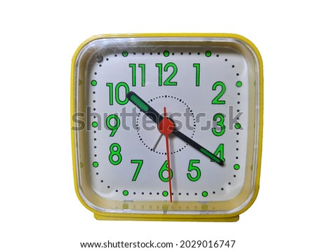 It's a picture of clock with time 10.20 pmam. With yellow color border and green color numbers with white background.  