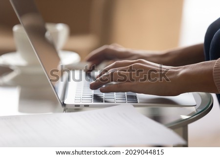 Close up view female hands typing on laptop. Lead correspondence to client remotely via e-mail app on laptop. Telework activity, writer create article, browse internet use modern wireless tech concept Royalty-Free Stock Photo #2029044815