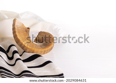 Rosh Hashanah. Yom Kippur. Tallit, shofar on a white background. Isolated Royalty-Free Stock Photo #2029084631