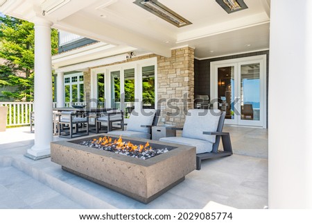 Luxury view home deck with ocean view fireplace hot tub and patio furniture