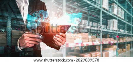 Smart warehouse management system with innovative internet of things technology to identify package picking and delivery . Future concept of supply chain and logistic network business . Royalty-Free Stock Photo #2029089578