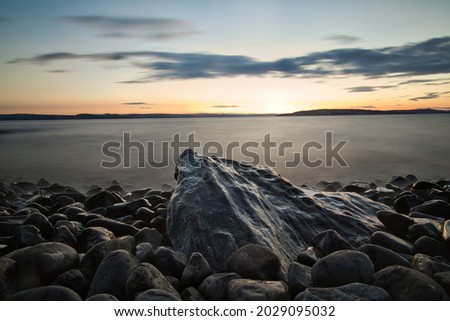 A long exposure picture of a sunset on the lake of Mjosa in Norway