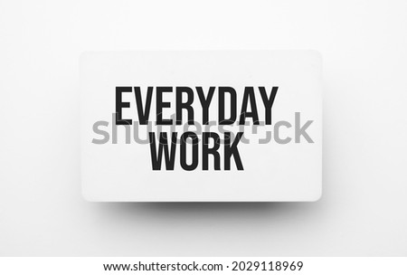 everyday work sign on notepad on the white backgound