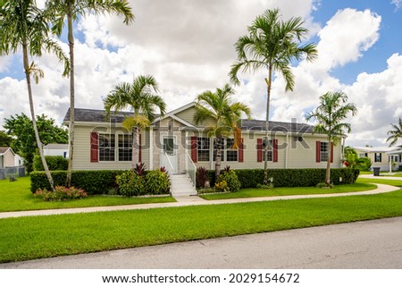 Modern style mobile home with palm trees Royalty-Free Stock Photo #2029154672