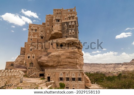  traditional Yemeni heritage architecture design details in historic Sanaa town and buildings in Yemen. Dar al-Hajar in Wadi Dhahr, a royal palace on a rock. iconic Yemeni building. Yemen Culture. Royalty-Free Stock Photo #2029158110