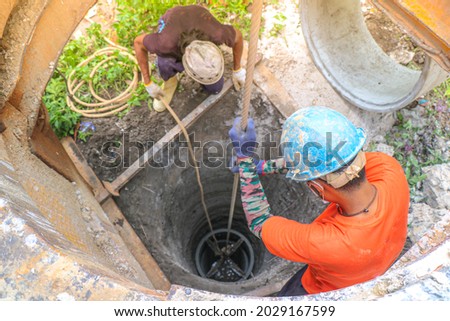 Water Well Drilling, Dig a well for water, Inside The Well, Groundwater hole drilling machine, boreholes, Deep pit in the ground Royalty-Free Stock Photo #2029167599