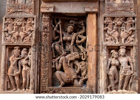 Ancient sandstone carvings on the walls of the ancient Indian temple.13th century A.D. Suka Sari temple, Bhubaneswar, Odisha, India. Royalty-Free Stock Photo #2029179083