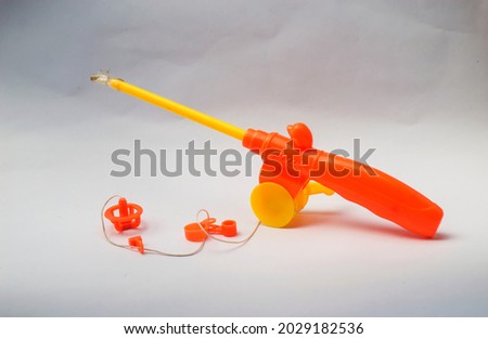 brightly colored fishing tackle toy isolated on a white background