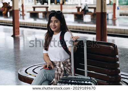 Image of A traveler looking for her friend for travel together. travel concept
