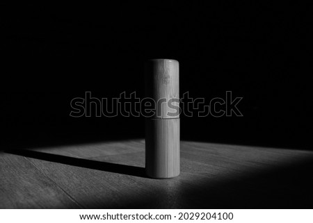 monochrome picture wood tube on black abstract background