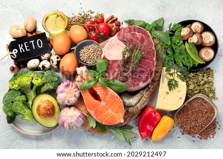 Keto diet food on light gray background. Healthy low carb, high fat diet. Top view, flat lay