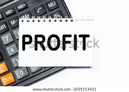 calculator, Notepad with text PROFIT . Business concept