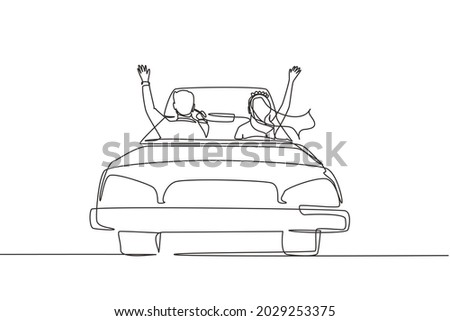 Continuous one line drawing happy married couple driving in cabriolet car cheering with arms raised. Man and woman wearing wedding dress going to wedding party. Single line draw design vector graphic Royalty-Free Stock Photo #2029253375