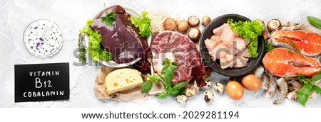 Natural sources of Vitamin B12 (Cobalamin) for sleep normalization; ensuring normal brain function; supporting the respiratory system; alzheimer's deasease treatment. Top view, flat lay, panorama Royalty-Free Stock Photo #2029281194