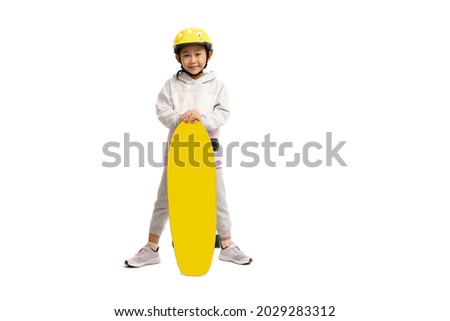 Asian little girl child with skateboard, isolate on white background.