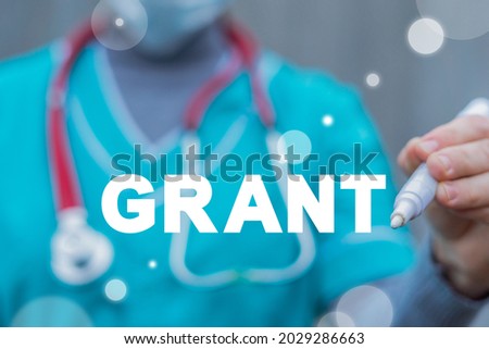 Medical concept of grant. Medicine grants. Financial support for hospital, clinic, doctors. Royalty-Free Stock Photo #2029286663
