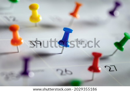Thumbtack in calendar concept for busy, appointment and meeting reminder Royalty-Free Stock Photo #2029355186