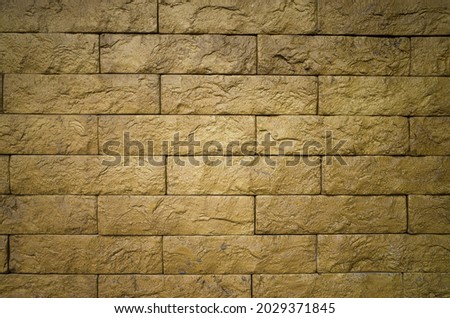 Yellow bricks pattern on wall for abstract background. Copy space.