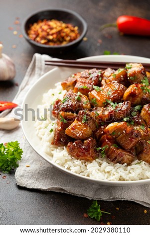 Chinese traditional cuisine sticky braised pork belly with rice on white plate Royalty-Free Stock Photo #2029380110