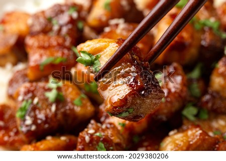 Chinese traditional cuisine sticky braised pork belly with rice on white plate Royalty-Free Stock Photo #2029380206