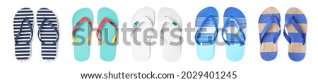 Set with different flip flops on white background, top view. Banner design Royalty-Free Stock Photo #2029401245