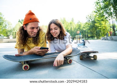 Professional skateboarders having fun at the skate park