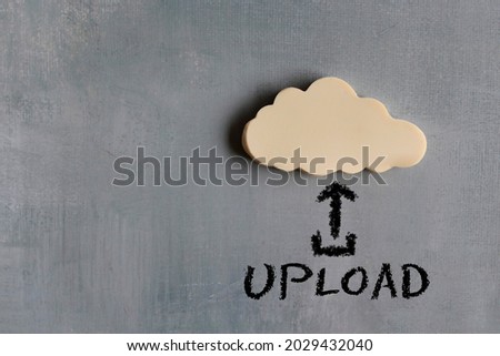 White cloud and text UPLOAD with upward arrow icon