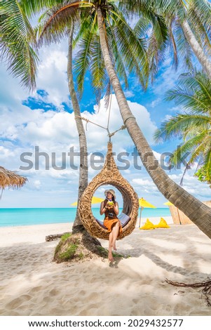 Summer lifestyle traveler woman relaxing on straw nests joy nature view landscape vacation luxury beach, Attraction place leisure tourist travel Thailand holiday, Tourism beautiful destination Asia Royalty-Free Stock Photo #2029432577