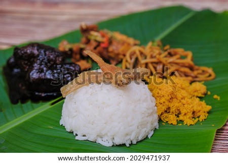 Nasik Ambeng, famous dish from Java served in banana leaves (shallow depth of field).
