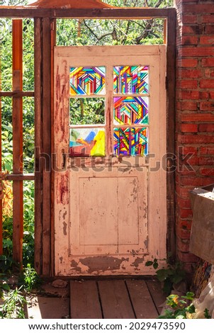 Old vintage wooden door with stained glass windows