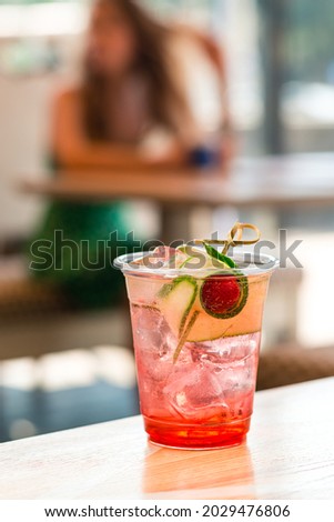 cold lemonade with strawberries in a summer cafe, Iced Strawberry Soda in a cafe shop with copy space background