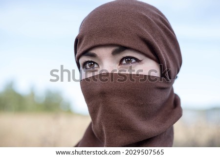 An Afghan woman in a hijab, close-up. The seizure of power. The Taliban. Royalty-Free Stock Photo #2029507565