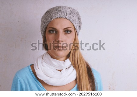 A studio shot of a Caucasian girl from Germany looking to the camera