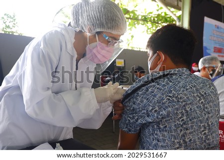 Photo of the Covid-19 Vaccination Process Royalty-Free Stock Photo #2029531667