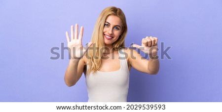 Young Uruguayan blonde woman over isolated background counting six with fingers